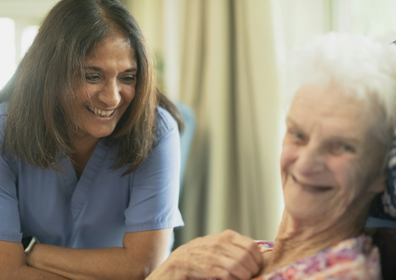 Nurse smiling with an older person